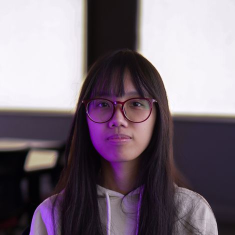 Photo of Yankun Xiao looking into the camera