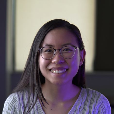 Photo of Jasmina Tang looking into the camera