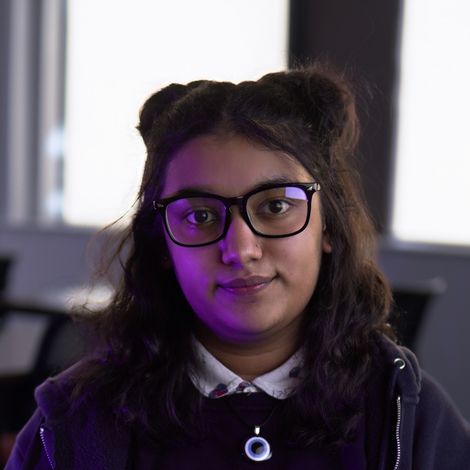 Photo of Tasneem Ahmed looking into the camera