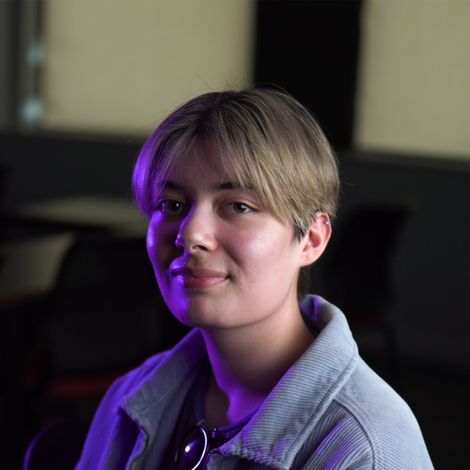 Photo of Hermione Khan looking into the camera