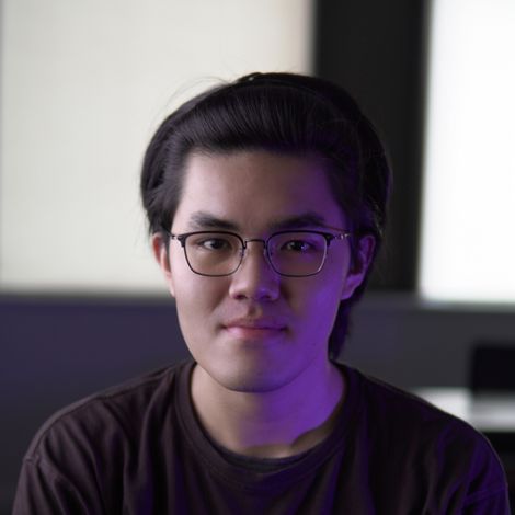 Photo of Edmund Wei looking into the camera